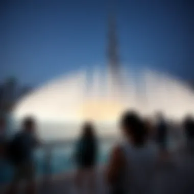 Visitors Enjoying Burj Khalifa Fountain Display Visitors enjoying the fountain display at dusk