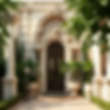 Exquisite entryway of a villa adorned with intricate detailing and lush landscaping